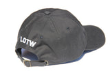 Side view of black LOTW GEAR dad hat with white embroidered logo