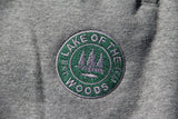 Green and grey embroidered logo on charcoal grey LOTW Gear relaxed sweatpants