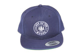 Front view of navy blue LOTW Gear snapback baseball hat with white embroidered logo