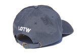 Side view of navy blue LOTW GEAR dad hat with white embroidered logo